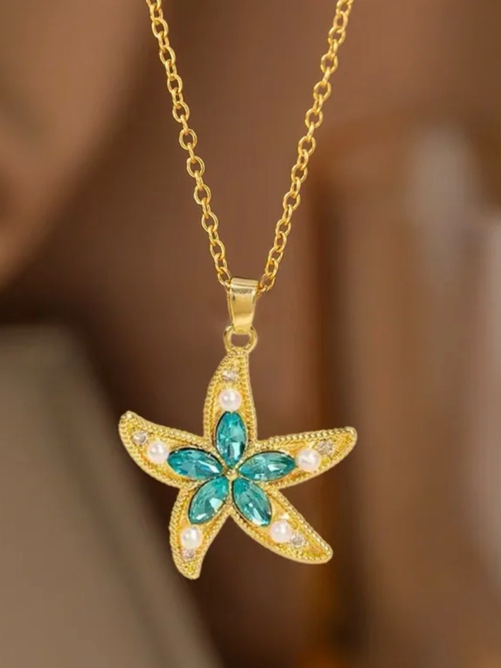 Gold Starfish Necklace with Teal Crystal Accents